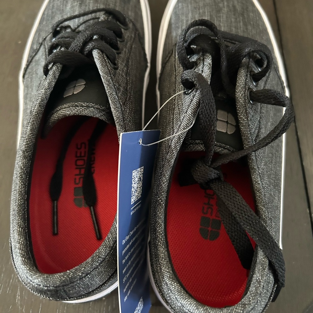 Black Sneakers, new with tags. Easy clean technology.